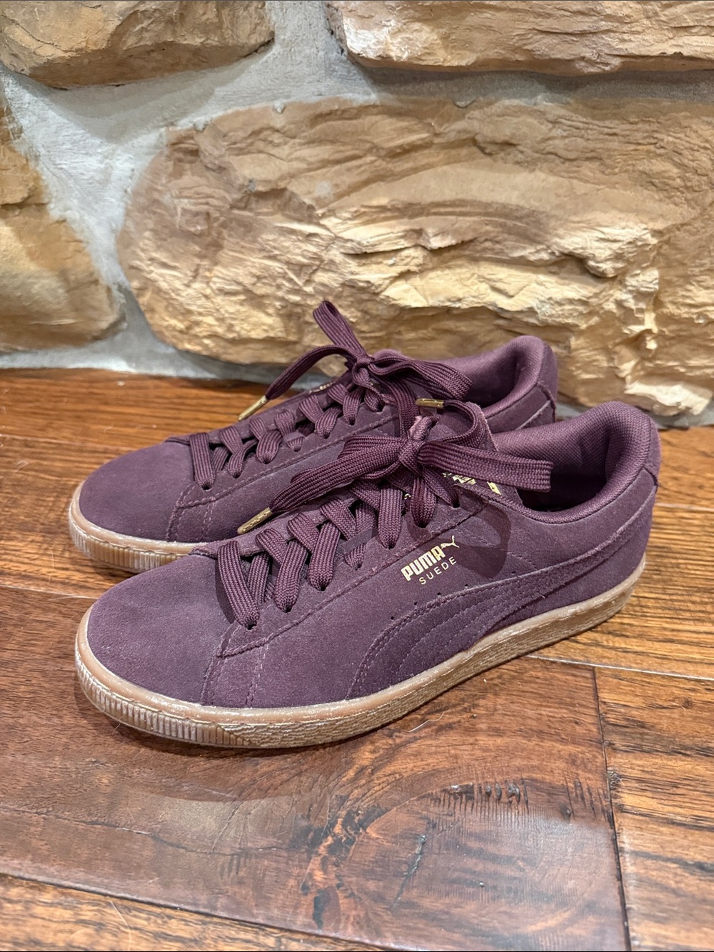Puma Suede Low-Top Sneakers in Maroon with Gold Accents